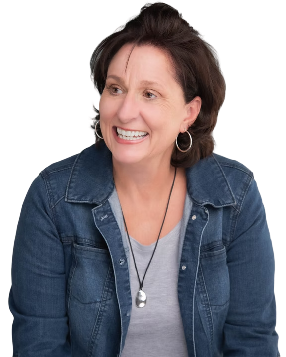 Sue Hough, founder of The Canopy, smiling in a denim jacket